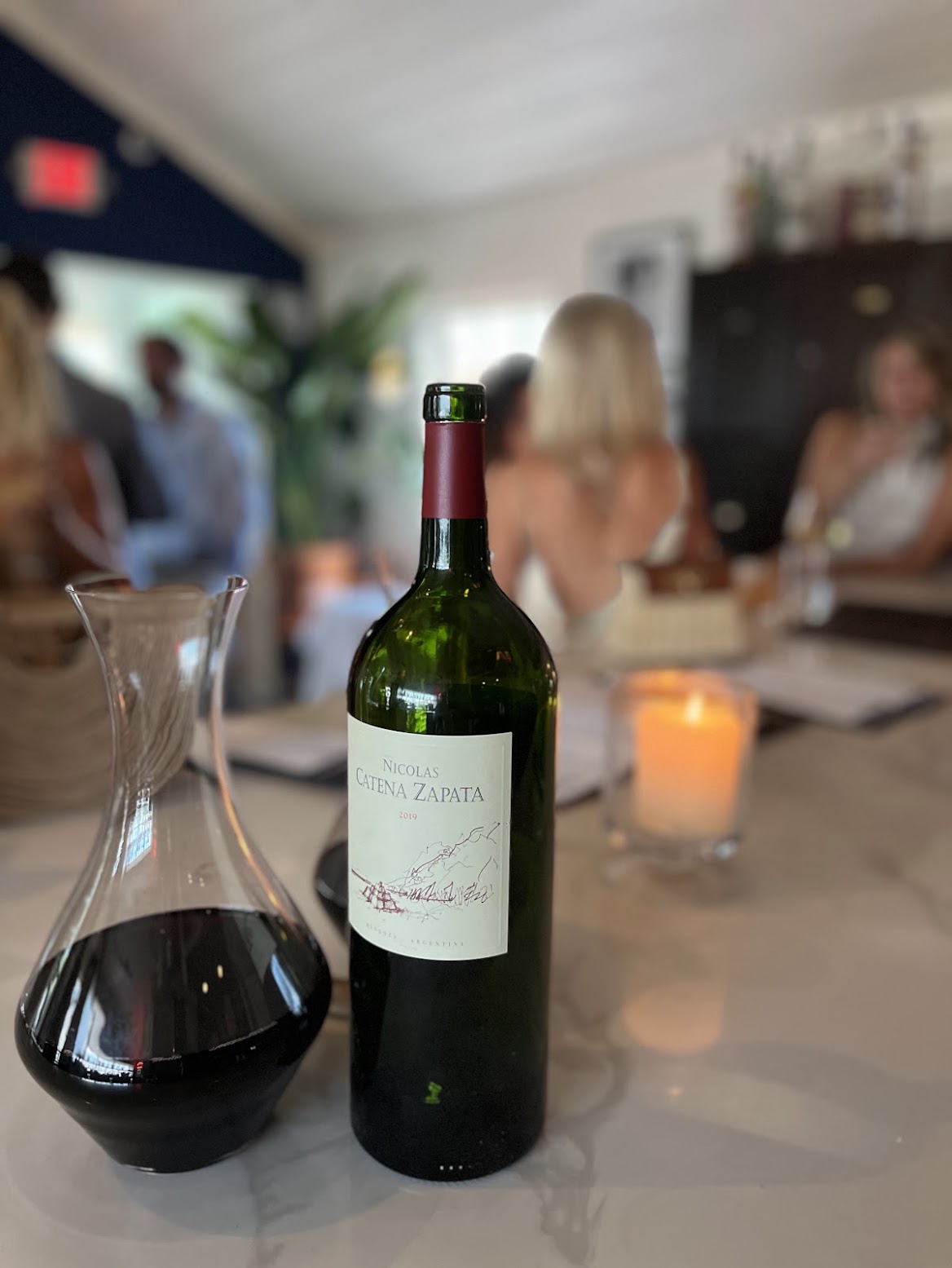 A bottle of Argentine Catena Zapata wine with a decanter in the Nicholson Muir dining room